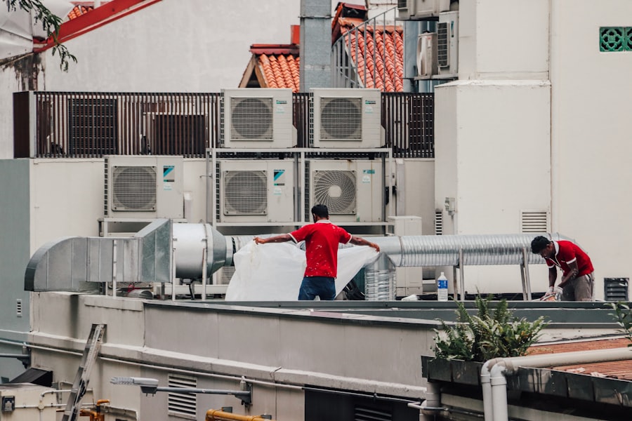 Technicians working on rooftop air conditioning units
